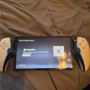 Sony PlayStation Handheld Console with Dual Blue and White Controllers